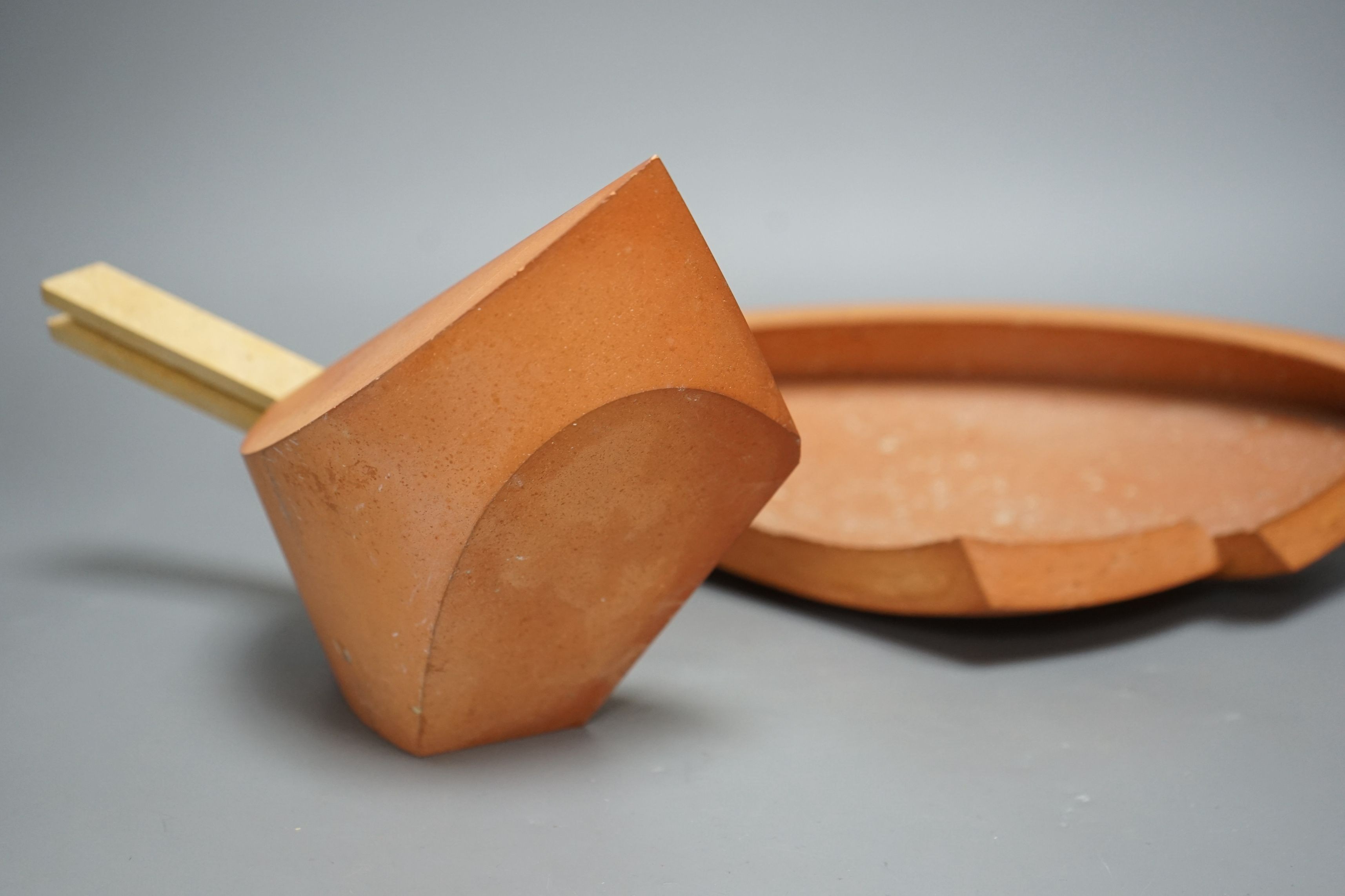 Martin Smith (b.1950), two disk forms, redware, one damaged, with original purchase receipt, largest 37cm wide (2)